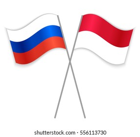 Russian and Monegasque crossed flags. Russia combined with Monaco isolated on white. Language learning, international business or travel concept.