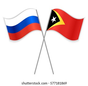 Russian and Timorese crossed flags. Russia combined with East Timor isolated on white. Language learning, international business or travel concept.
