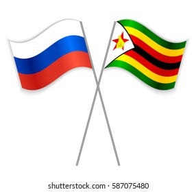 Russian and Zimbabwean crossed flags. Russia combined with Zimbabwe isolated on white. Language learning, international business or travel concept.