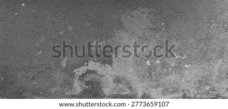 Rustic concrete wall texture with rough stone surface and weathered cement pattern in gray color. Grunge background with scratches and aged industrial material for architectural or vintage design.