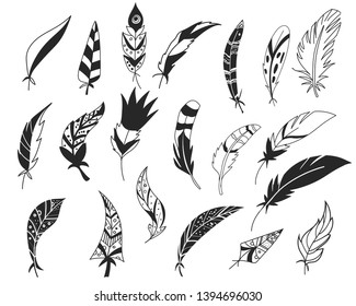 Rustic decorative feathers. Hand drawn vintage vector design set. Tribal Feathers. Ink illustration. Isolated on white background.