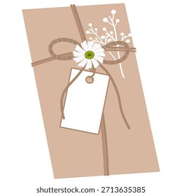 Regalo rústico atado con cordeles, etiqueta en blanco, margarita y acentos florales