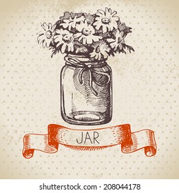 Rustic jar with chamomile bouquet. Vintage hand drawn sketch design. Vector illustration