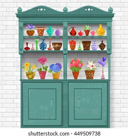 rustic kitchen interior with grunge vintage cupboard. beautiful flowers planted in cute ceramic pots and art vases