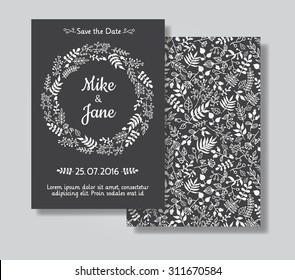 Rustic wedding invitation card set. White floral wreath on black chalkboard background. Save the date and invitation card