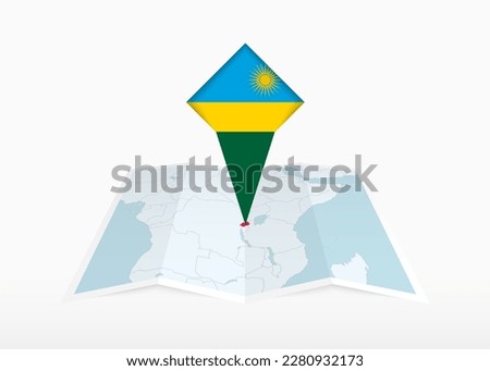 Rwanda is depicted on a folded paper map and pinned location marker with flag of Rwanda. Folded vector map.