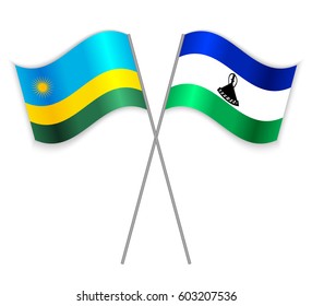Rwandan and Basotho crossed flags. Rwanda combined with Lesotho isolated on white. Language learning, international business or travel concept.