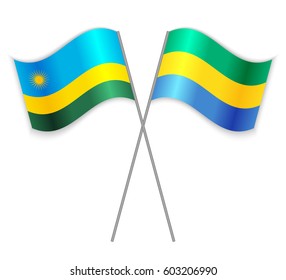 Rwandan and Gabonese crossed flags. Rwanda combined with Gabon isolated on white. Language learning, international business or travel concept.