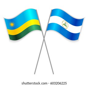 Rwandan and Nicaraguan crossed flags. Rwanda combined with Nicaragua isolated on white. Language learning, international business or travel concept.