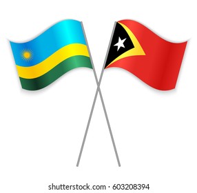 Rwandan and Timorese crossed flags. Rwanda combined with East Timor isolated on white. Language learning, international business or travel concept.