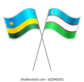 Rwandan and Uzbek crossed flags. Rwanda combined with Uzbekistan isolated on white. Language learning, international business or travel concept.
