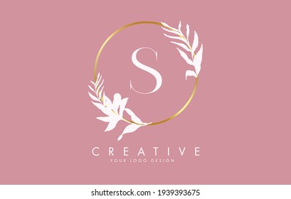 S Letter logo design with golden circles and white leaves on branches around it. Vector Illustration with S letter for personal branding, corporate, business, eco friendly or natural products. 