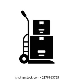 Sack truck icon with boxes on it in black solid style