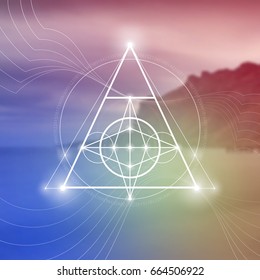 Sacred geometry illustration with interlocking circles and triangles, flows of energy, golden ratio numbers and particles in front of natural photographic background.