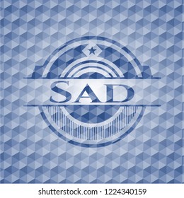 Sad blue badge with geometric pattern.