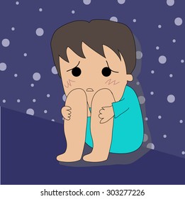 Sad boy with depression sitting on the floor