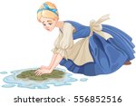 Sad Cinderella cleaning the floor with floor cloth 