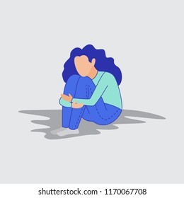 Sad and depressed girl sitting on the floor. Depressed teenager. Sad woman Unhappy and stressed student. 