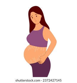 Sad depressed pregnant woman looking at pregnancy belly with stretch marks.