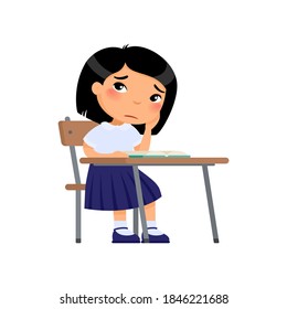 Sad elementary school student flat color vector illustration. Unhappy asian schoolgirl sitting at table and reading book. Girl in school uniform doing homework isolated cartoon character 