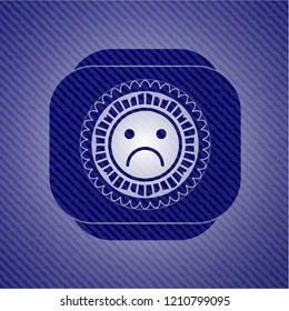 sad face icon with denim texture