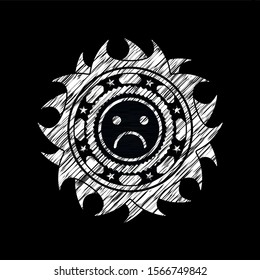 sad face icon drawn with chalkboard texture