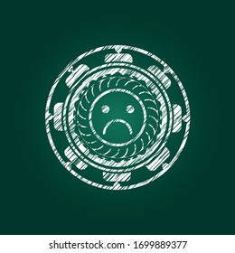 sad face icon drawn on blackboard