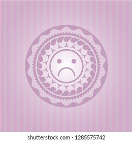 sad face icon inside badge with pink background