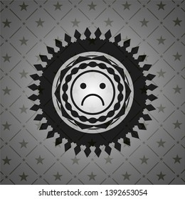 sad face icon inside black badge