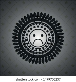 sad face icon inside black emblem