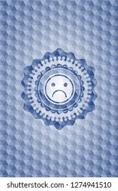 sad face icon inside blue hexagon badge.