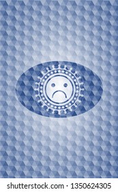 sad face icon inside blue emblem or badge with abstract geometric polygonal pattern background.