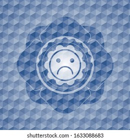 sad face icon inside blue emblem with geometric pattern background.