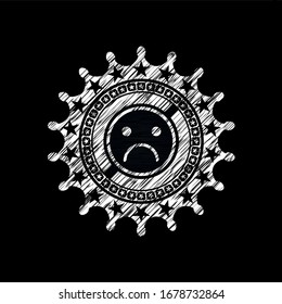 sad face icon inside chalk emblem