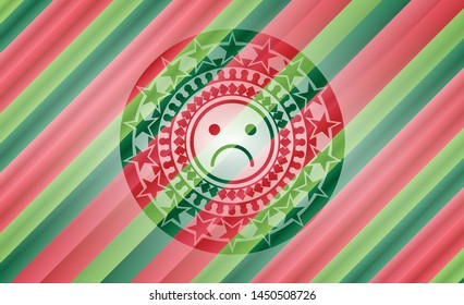 sad face icon inside christmas colors style emblem.