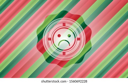 sad face icon inside christmas colors emblem.