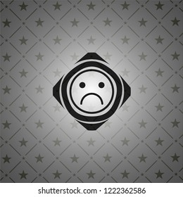 sad face icon inside dark badge or emblem