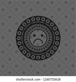 sad face icon inside dark emblem. Retro
