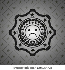 sad face icon inside dark badge