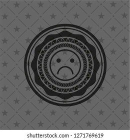 sad face icon inside dark badge