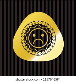 sad face icon inside gold badge or emblem