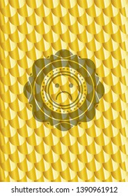 sad face icon inside gold badge or emblem. Scales pattern. Vector Illustration. Detailed.