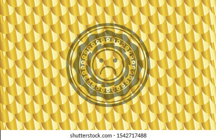 sad face icon inside gold shiny badge. Scales pattern. Vector Illustration. Detailed.