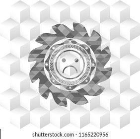 sad face icon inside grey badge with geometric cube white background