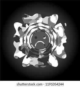 sad face icon inside grey camouflage texture