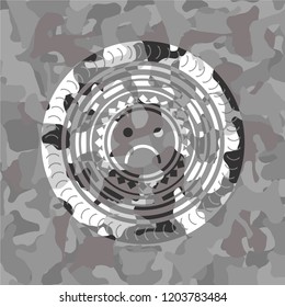 sad face icon inside grey camouflage emblem