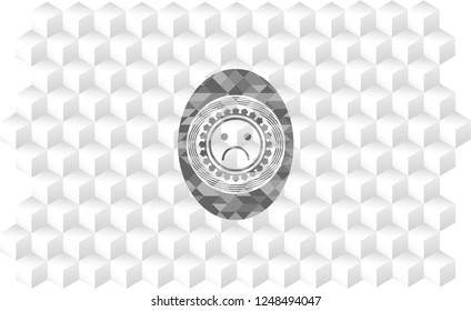 sad face icon inside grey badge with geometric cube white background