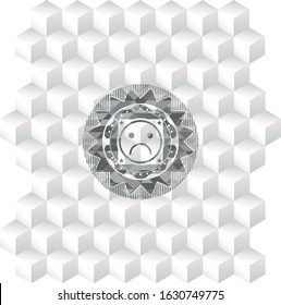 sad face icon inside grey icon or emblem with geometric cube white background
