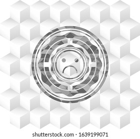 sad face icon inside grey icon or emblem with geometric cube white background