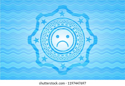 sad face icon inside light blue water wave style emblem.